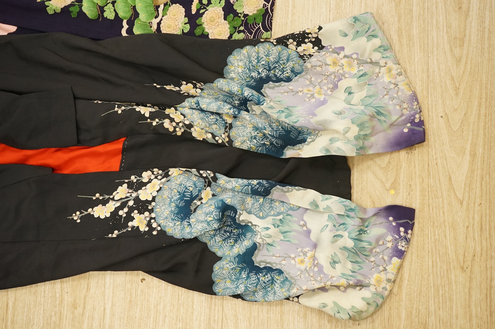 A collection of Chinese and Japanese embroidered kimonos and textiles